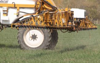 A contractor applying Omex liquid nitrogen to winter wheat
