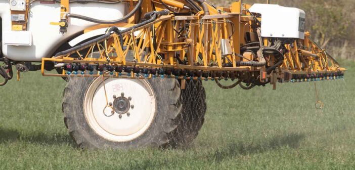 A contractor applying Omex liquid nitrogen to winter wheat