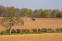 Tractor working in field