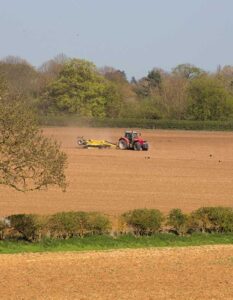 Tractor working in field