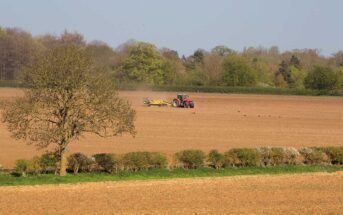 Tractor working in field