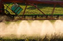 Spraying Wheat in the late Winter Sun.